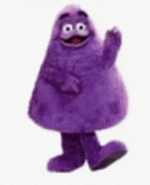 a purple cartoon character is standing on a white background and waving .