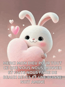 a white bunny holding a pink heart with the words merci mon dieu pour tout