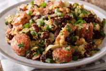 a close up of a plate of food with beans and meat