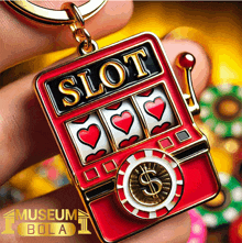 a person is holding a slot machine key chain