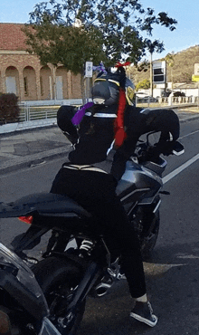 a person on a motorcycle with a helmet on their head