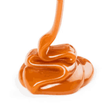 a swirl of caramel is being poured on a white background