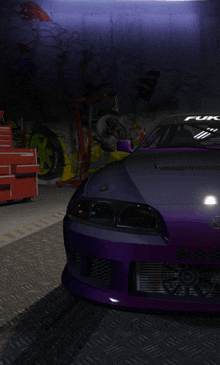 a purple car is parked in a garage with graffiti on the walls