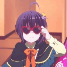 a purple haired anime girl wearing sunglasses is sitting in a room .