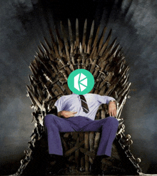 a man in purple pants sits on a throne with a green circle on his head