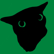 a silhouette of a cat 's head with green eyes