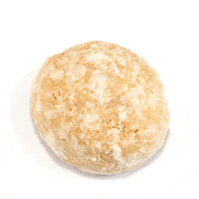 a close up of a bread ball on a white background