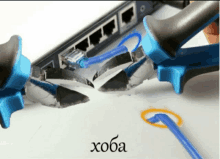 a pair of pliers cutting a cable with the word hoba below