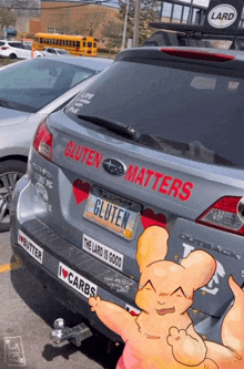 a car with a sticker on the back that says " gluten matters "