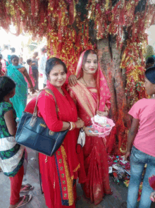 a woman in a red dress has a purse that says ' amanda ' on it