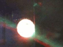 a blurred image of a street light with a red and green light