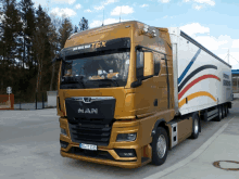 a man truck with a tgx sticker on the windshield