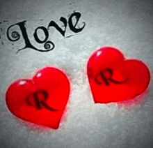 two red hearts with letters r and r on them