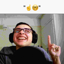 a man wearing glasses and headphones is smiling and giving a thumbs up