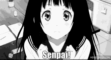 a black and white anime girl is sitting at a desk and says senpai !