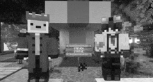 two minecraft characters standing next to a steven statue