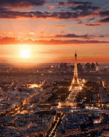 an aerial view of paris at sunset with the eiffel tower in the background