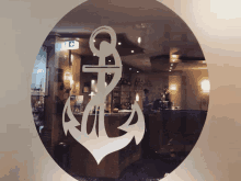 a circle with an anchor on it in a restaurant