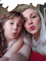 a woman and a little girl are making funny faces together