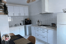 a kitchen with a stove top oven and a dishwasher