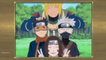 a group of anime characters posing for a picture with a videokca logo on the bottom right