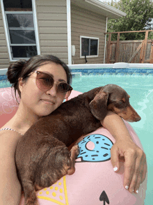 a woman and a dog are in a pool