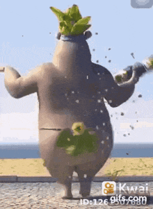 a cartoon bear is standing on a beach holding a bottle of champagne .