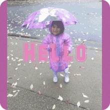 a little girl wearing a purple raincoat and holding a purple umbrella with the word hello written in pink