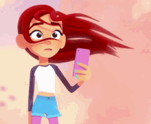 a girl with red hair is holding a cell phone