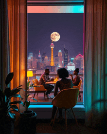 a man and a woman sit at a table looking out a window at a city skyline