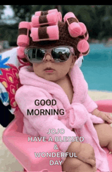 a baby wearing pink curlers and sunglasses says good morning