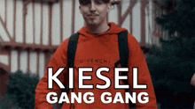 a man in a red givenchy hoodie is featured in a kiesel gang gang video