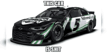 a black and green nascar race car with the number 5 on the side .