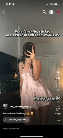 a woman in a pink dress is taking a picture of herself with her phone