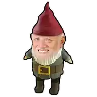 a gnome with a red hat and a beard