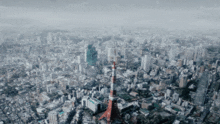 an aerial view of a city with tokyo tower in the foreground