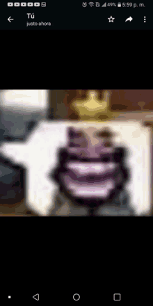 a blurred image of a person with a crown on their head