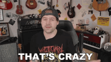 a man wearing a black shirt that says " that 's crazy "