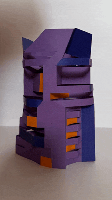 a purple and orange sculpture of a building