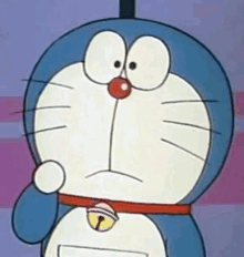 a close up of a cartoon character called doraemon with a bell around his neck .