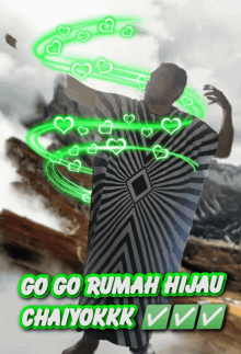 a man in a black and white striped robe is surrounded by green hearts and the words go go rumah hijau chaiykkk