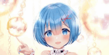 a girl with blue hair is holding a sphere in her hand and pointing at it .