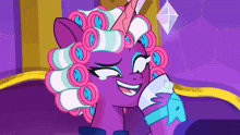 a purple pony with curlers on her hair is smiling and holding a glass