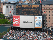 a scoreboard at a baseball stadium with toyota and pnc ads