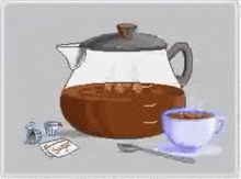 a teapot filled with coffee next to a cup of coffee and a spoon .