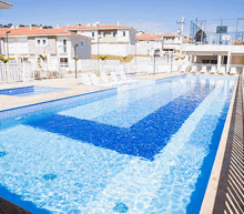 a large swimming pool with a blue and white striped design