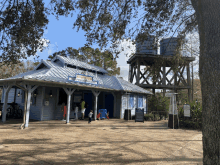 a blue and white building with a sign that says ' jacksonville bicycle shop ' on it