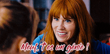 a woman with red hair is smiling with the words meufs tes un genie
