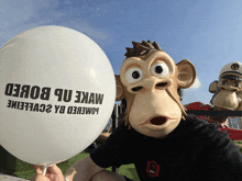 a person in a monkey mask holds a white balloon