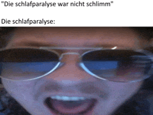 a man wearing sunglasses with the words " die schlafparalyse war nicht schlimm " above him